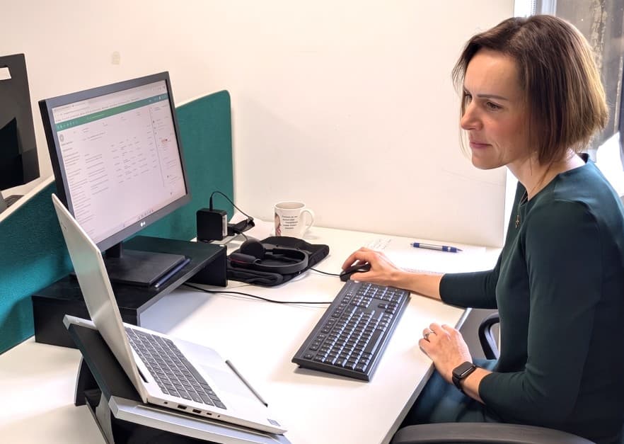 Ilona at her desk at Carbon Footprint Ltd